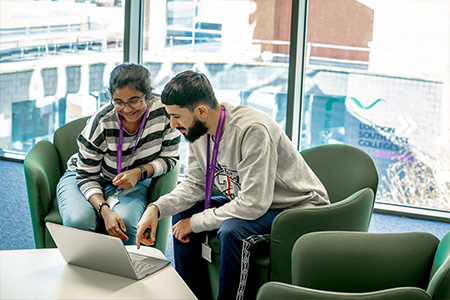 two students in the uni centre viewing a 